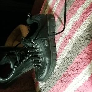 A pair of sketchers relaxed fit sneakers..